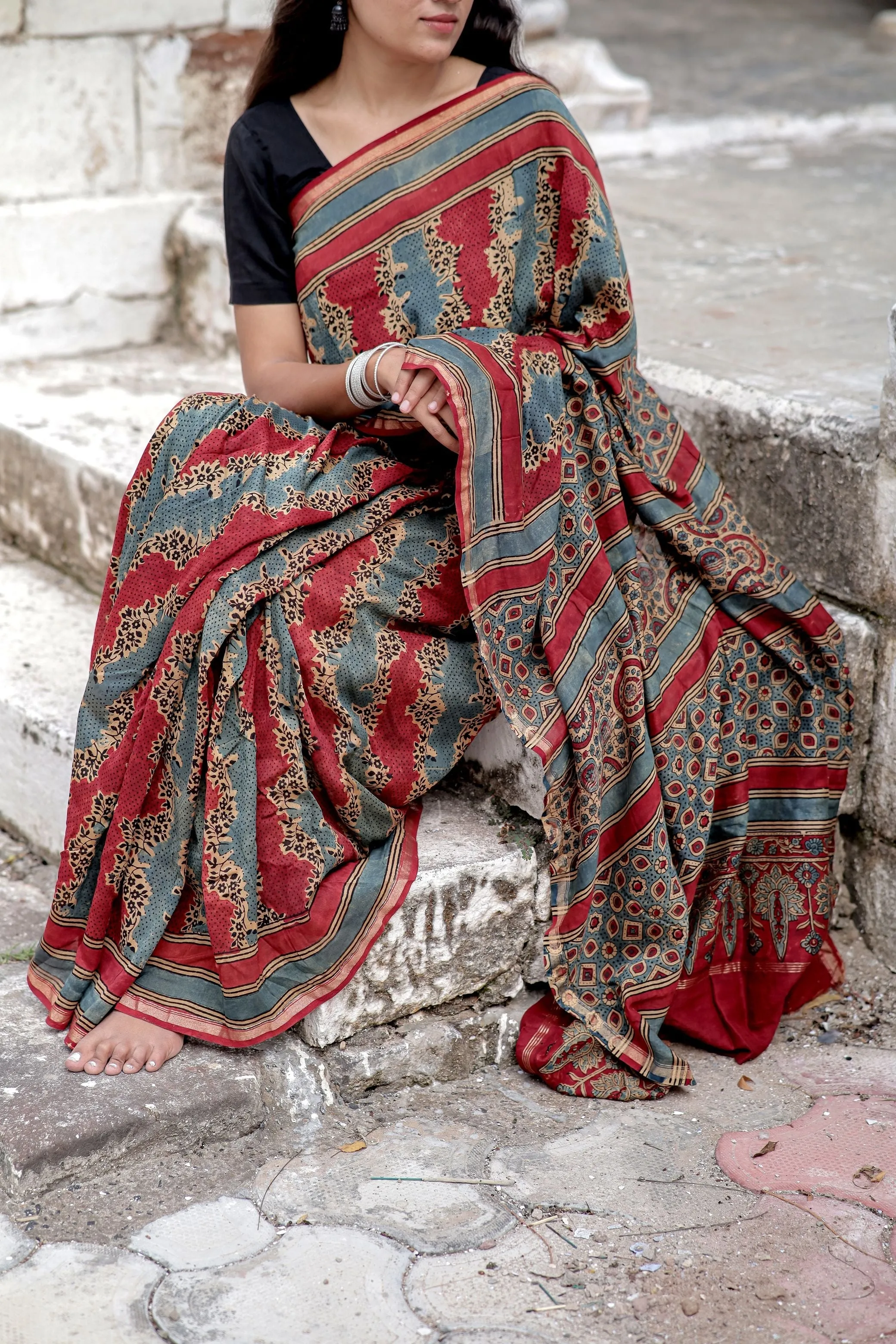A trsyt with Ajrakh -Jharokha -Geometric Blue and Red Chanderi ajrakh saree