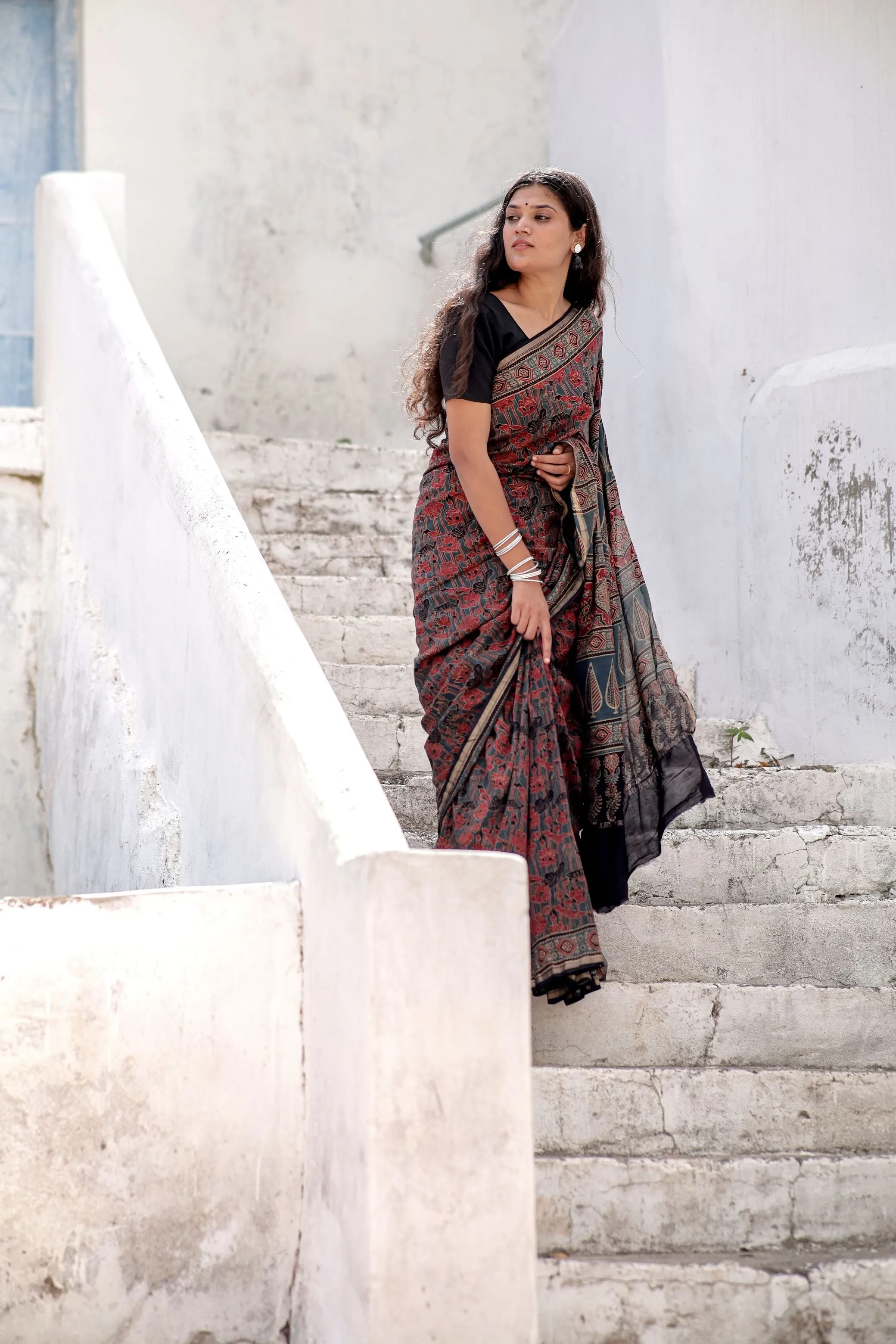 A trsyt with Ajrakh -Jharokha -Geometric Blue and Red Chanderi ajrakh saree