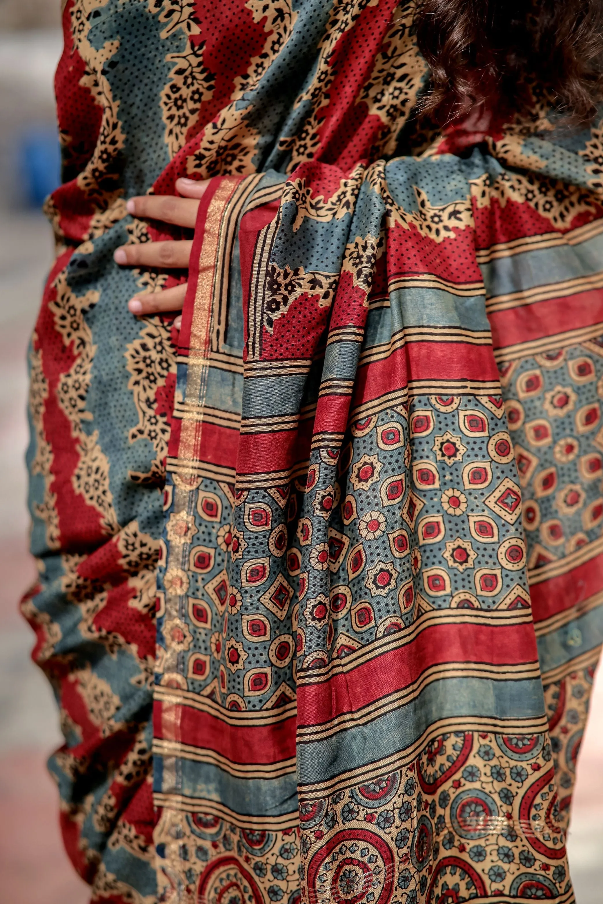 A trsyt with Ajrakh -Jharokha -Geometric Blue and Red Chanderi ajrakh saree