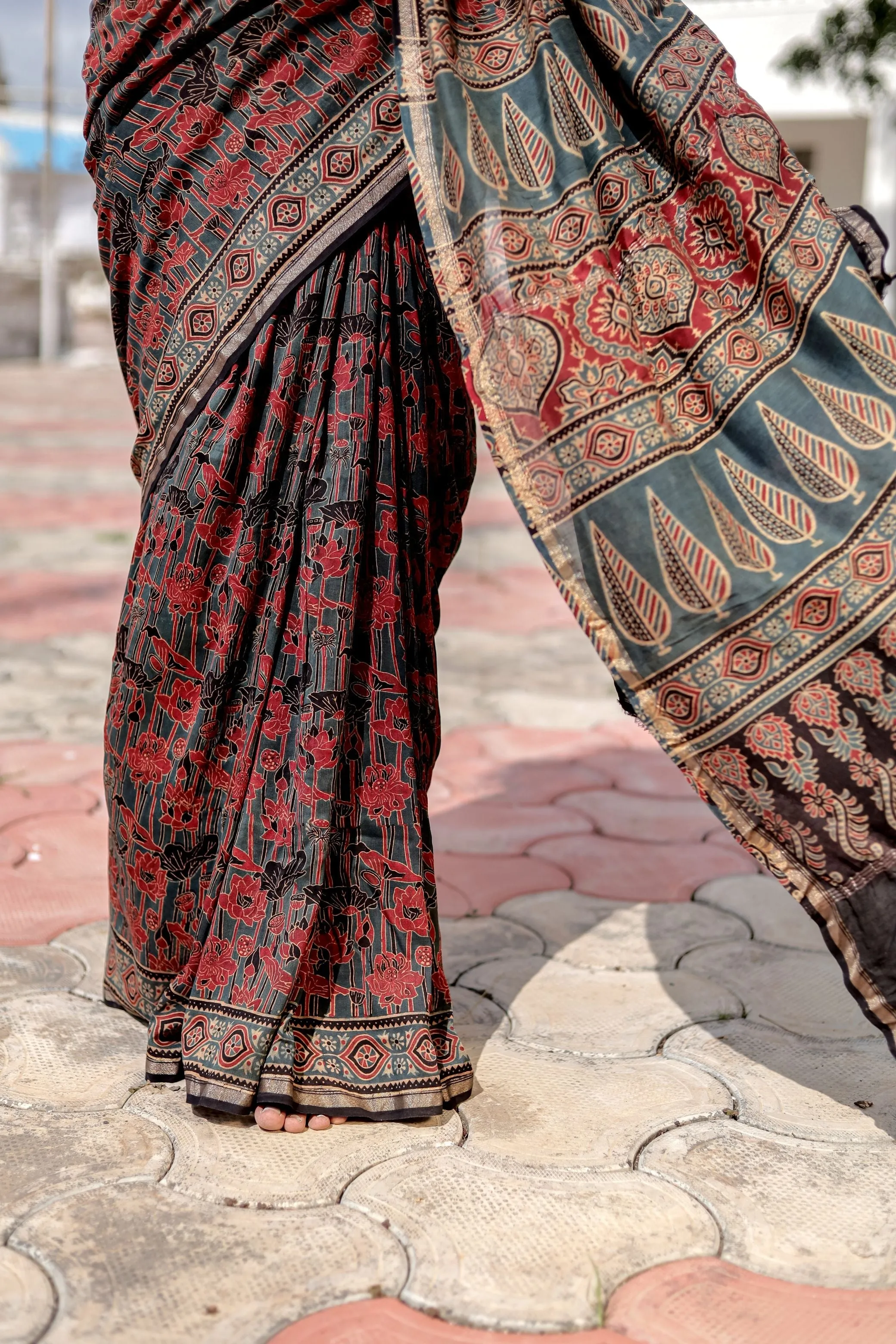 A trsyt with Ajrakh -Jharokha -Geometric Blue and Red Chanderi ajrakh saree