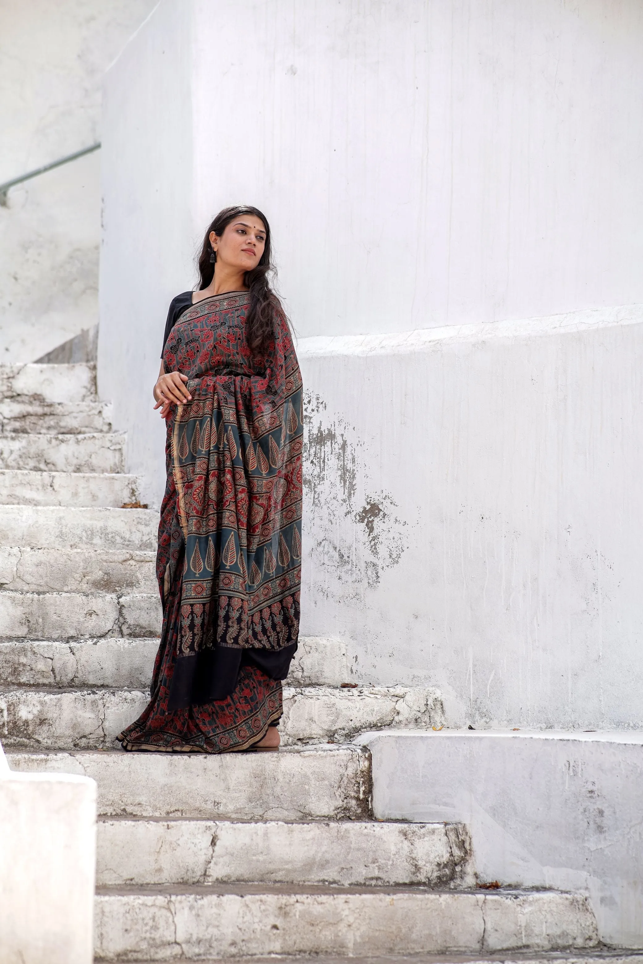 A trsyt with Ajrakh -Jharokha -Geometric Blue and Red Chanderi ajrakh saree