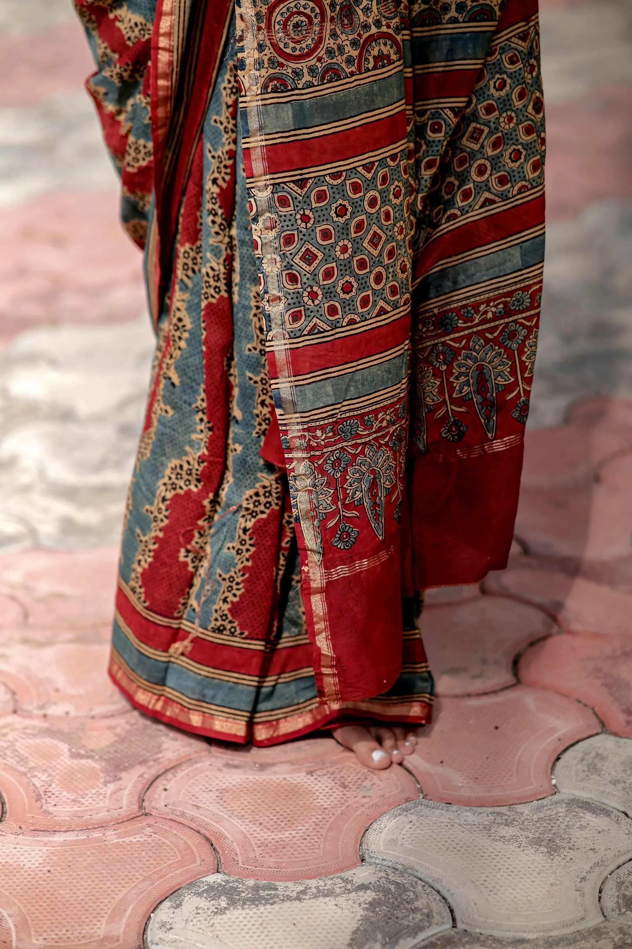 A trsyt with Ajrakh -Jharokha -Geometric Blue and Red Chanderi ajrakh saree