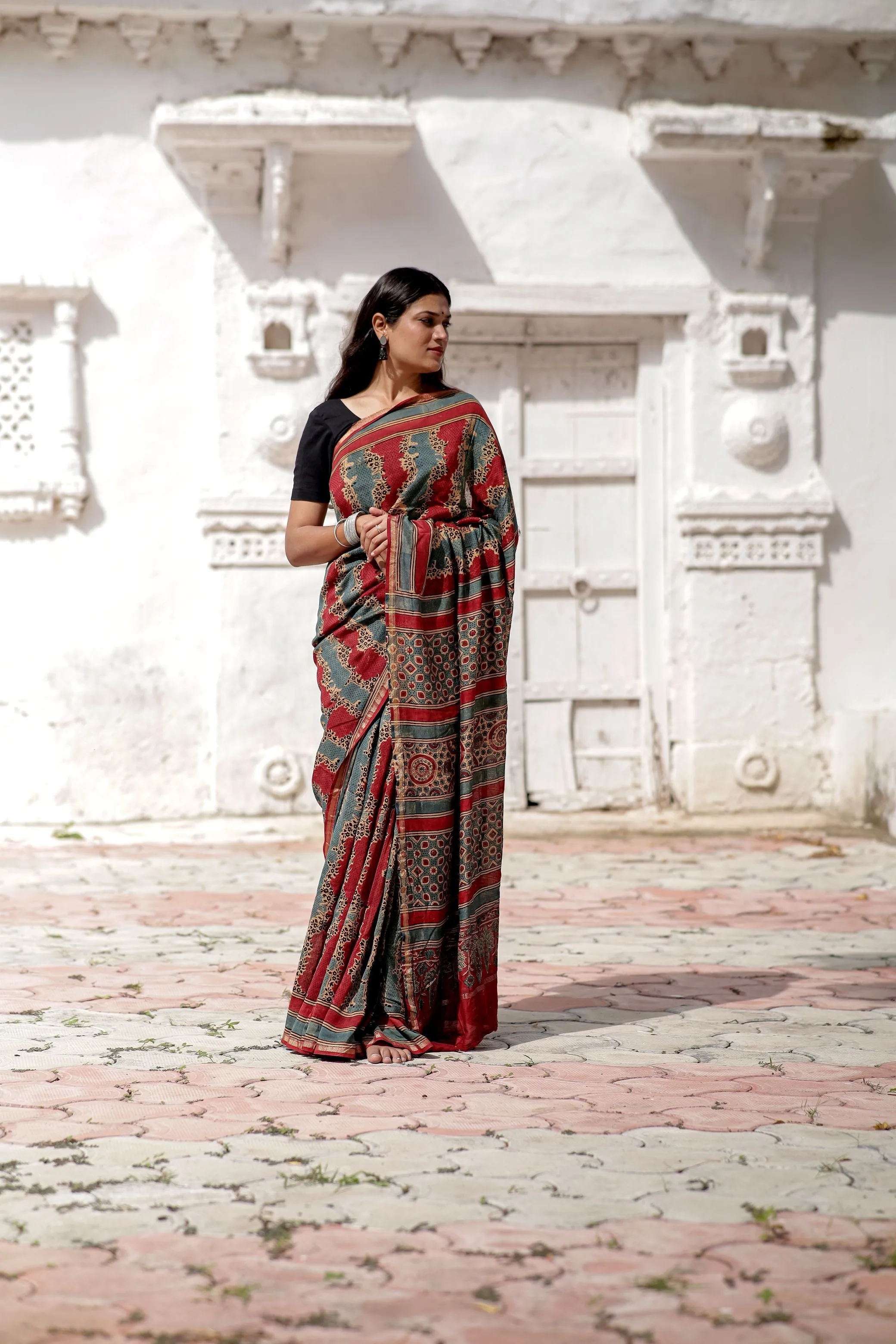 A trsyt with Ajrakh -Jharokha -Geometric Blue and Red Chanderi ajrakh saree