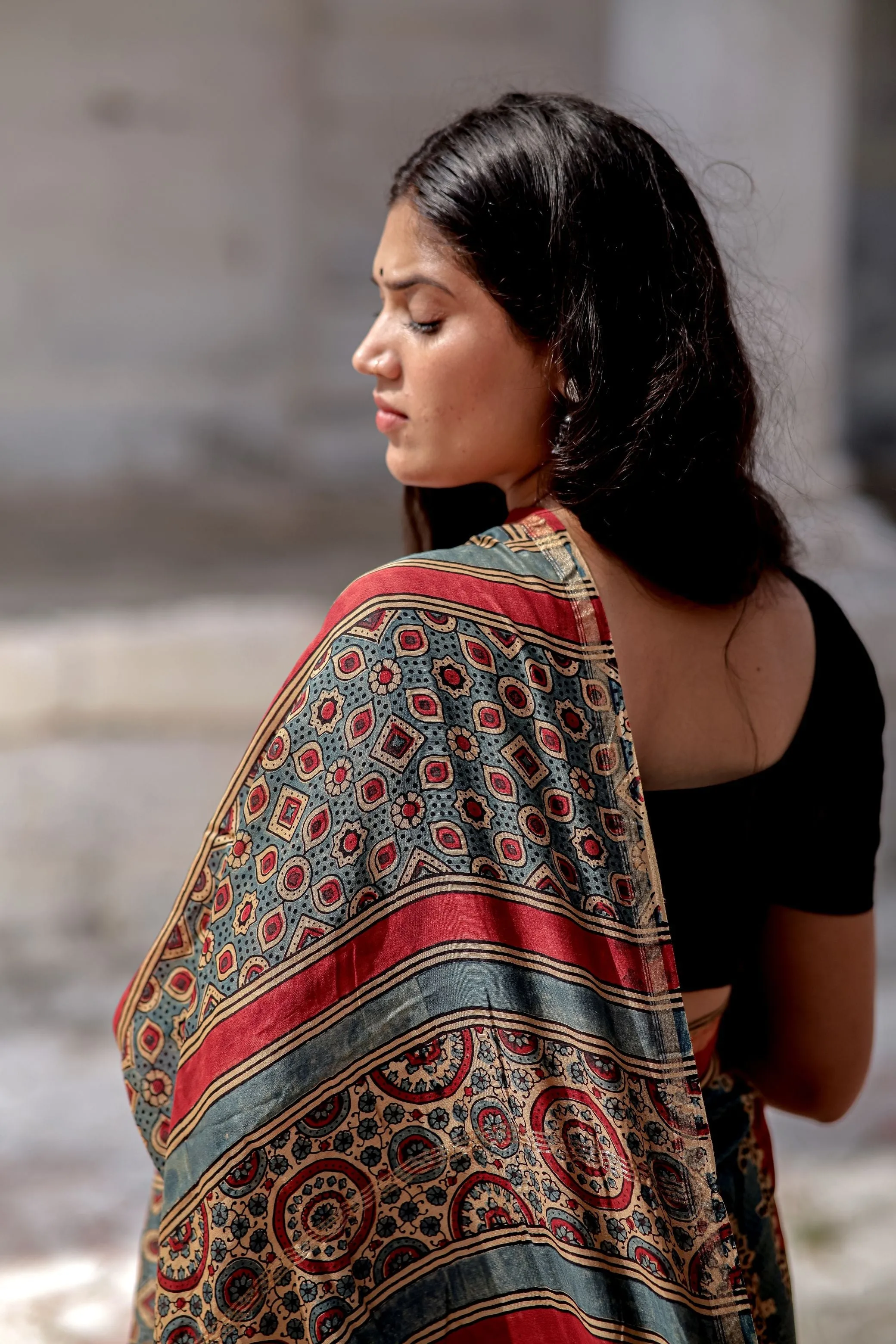 A trsyt with Ajrakh -Jharokha -Geometric Blue and Red Chanderi ajrakh saree