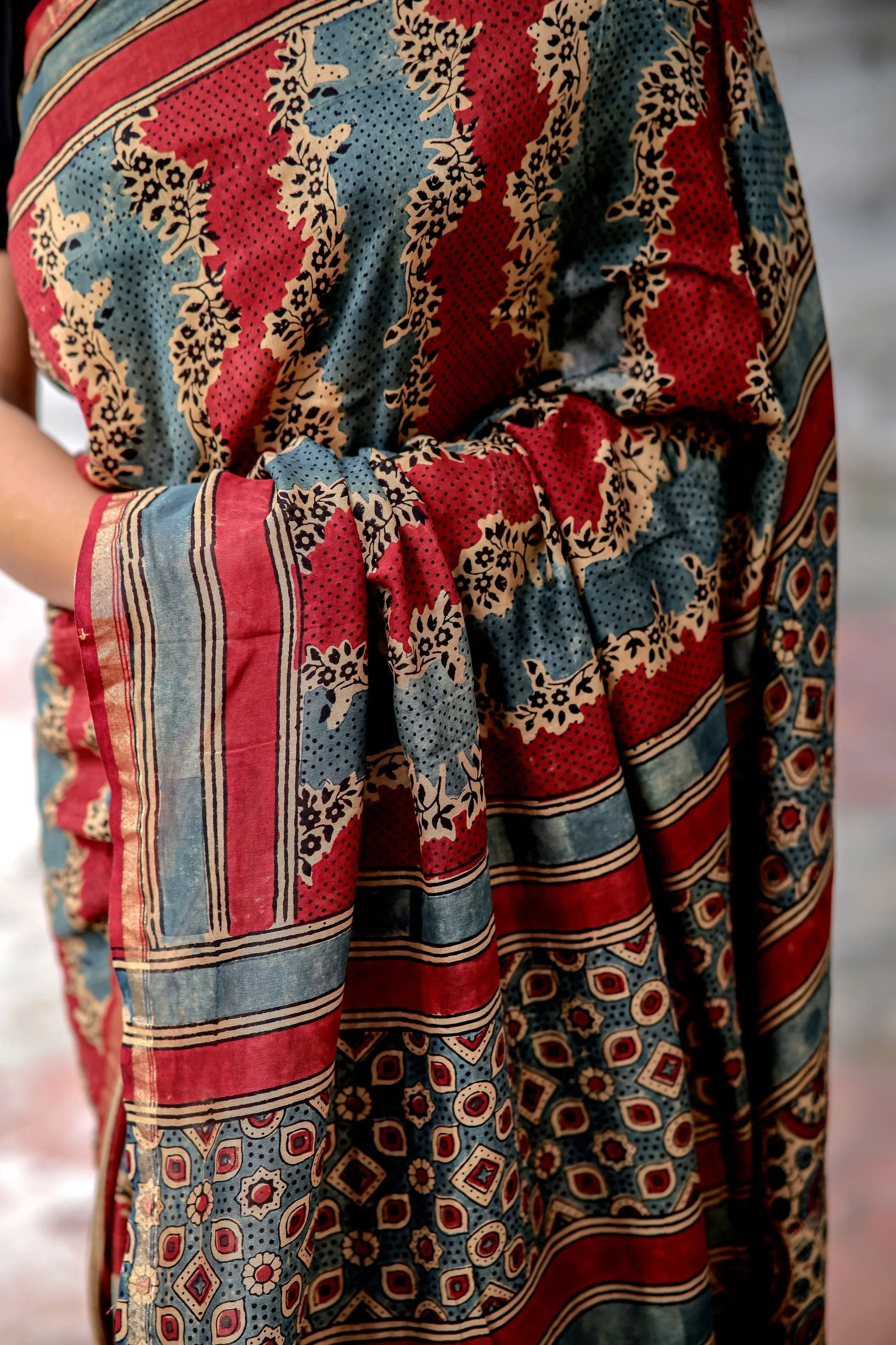 A trsyt with Ajrakh -Jharokha -Geometric Blue and Red Chanderi ajrakh saree