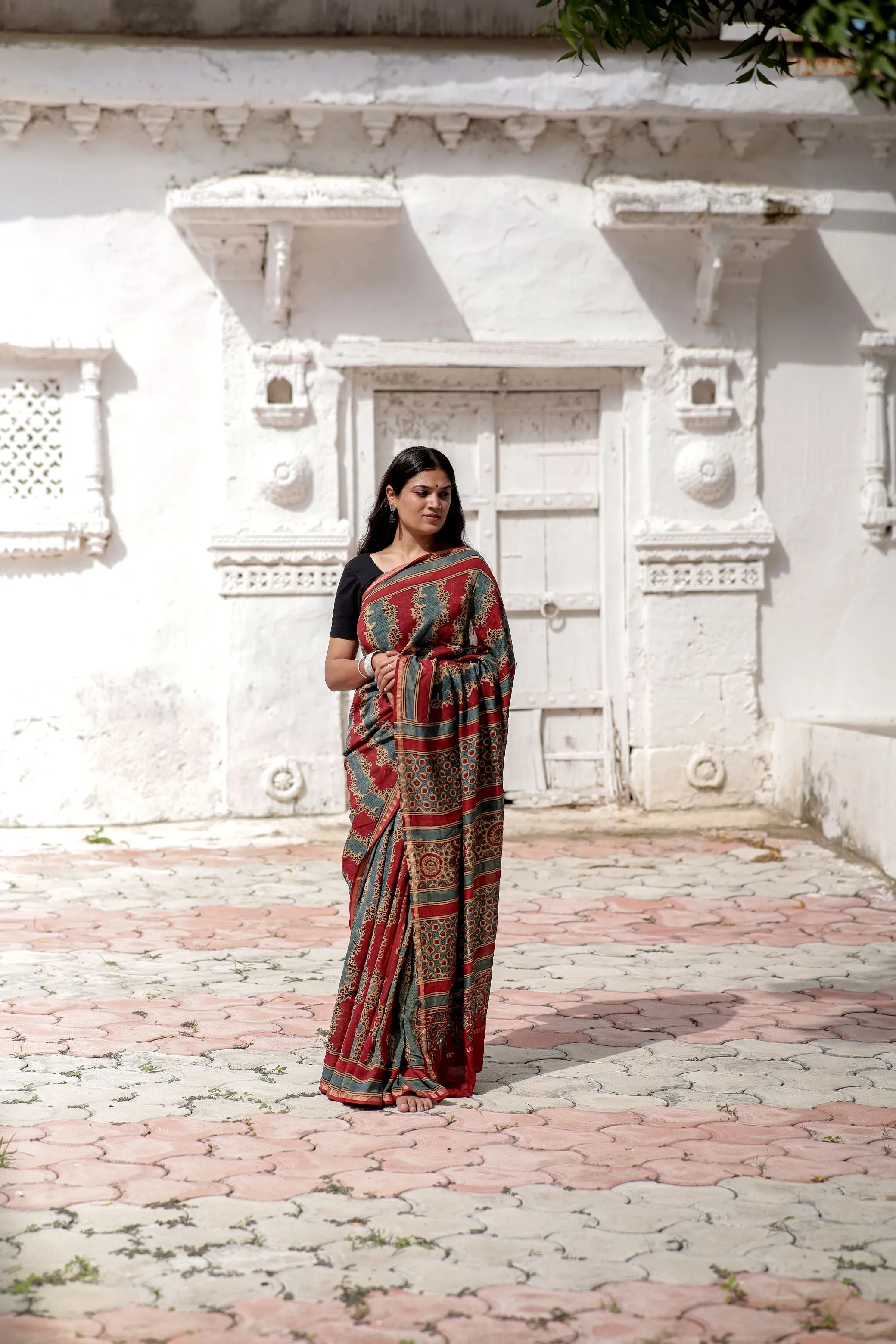 A trsyt with Ajrakh -Jharokha -Geometric Blue and Red Chanderi ajrakh saree