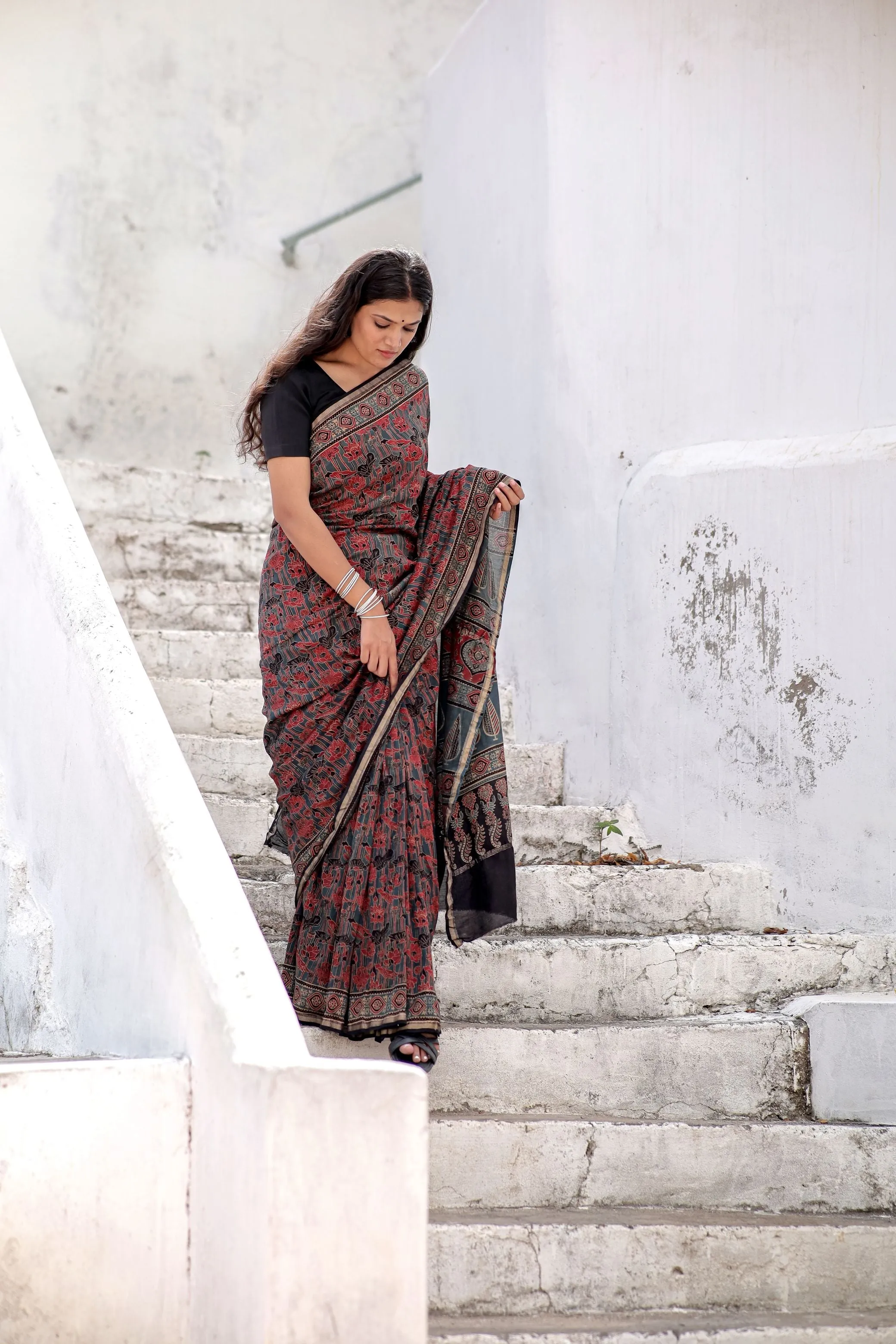 A trsyt with Ajrakh -Jharokha -Geometric Blue and Red Chanderi ajrakh saree